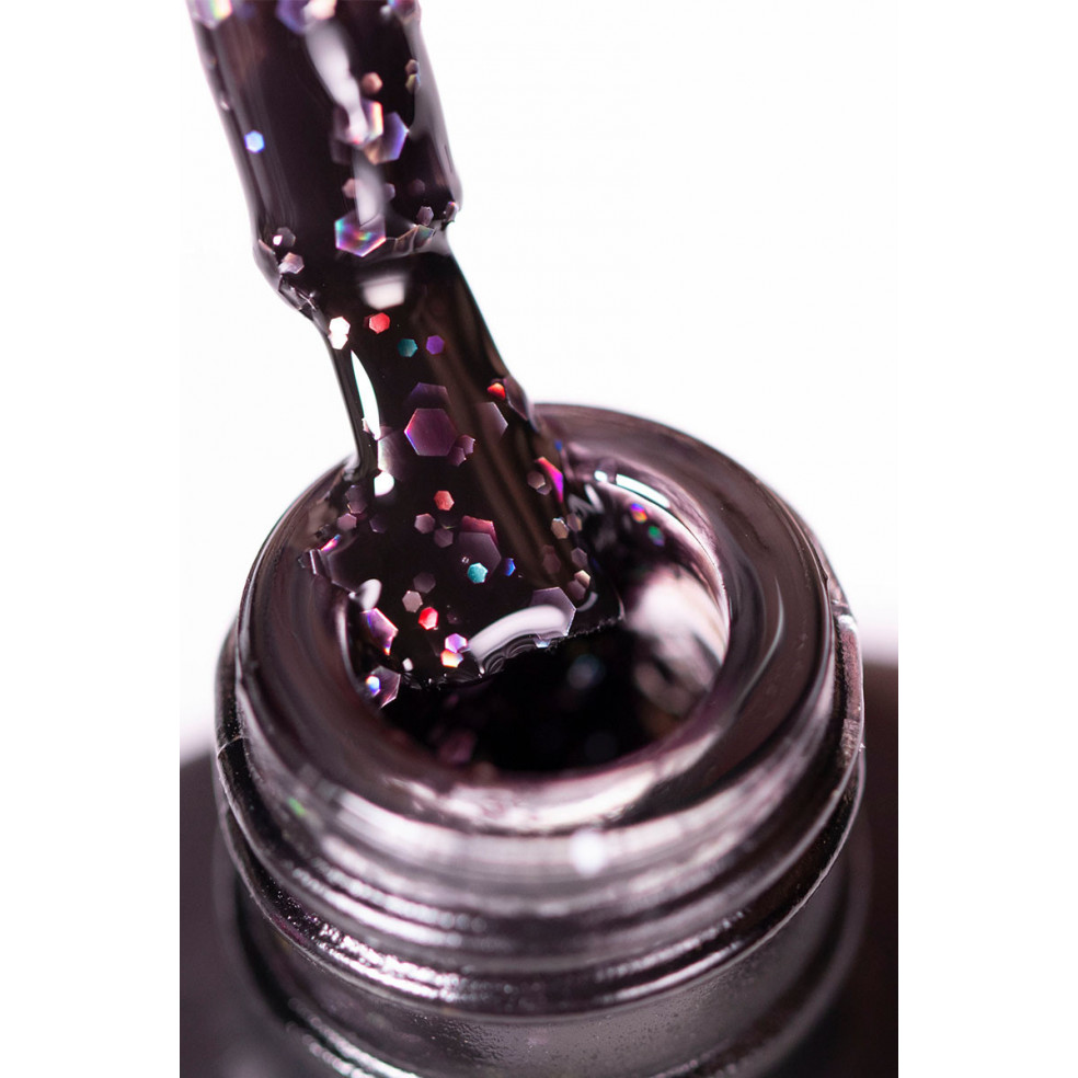 Pędzelek zanurzony w lakierze hybrydowym z wielokolorowym brokatem Pędzelek zanurzony w lakierze hybrydowym z wielokolorowym brokatem