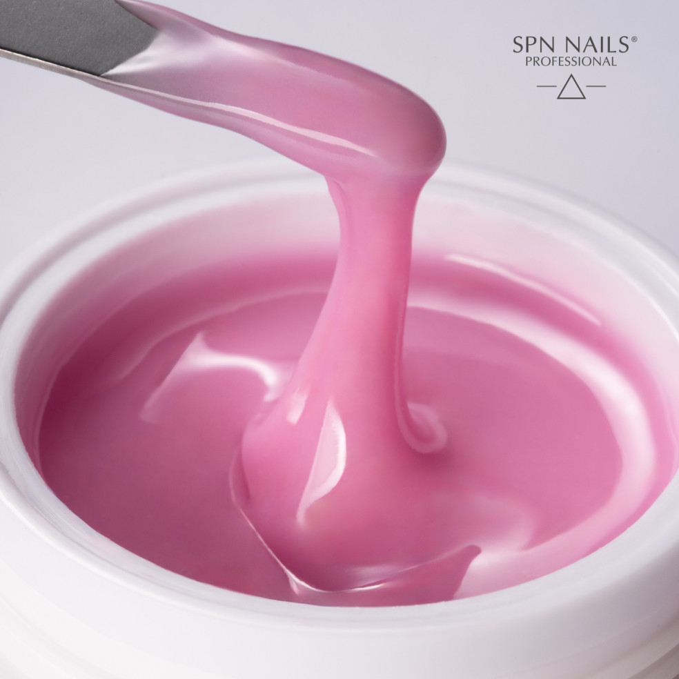 Szpatułka zanurzona w żelu z tiksotropią w kolorze różowym
